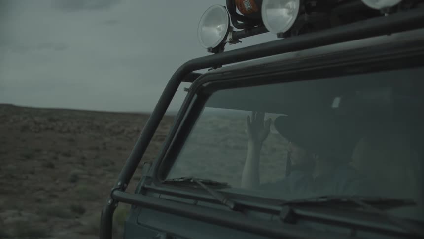 A person riding in the passenger seat of a car