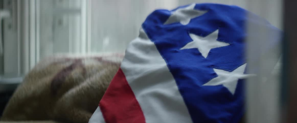 Leotards bearing an american flag motif lay on a towel