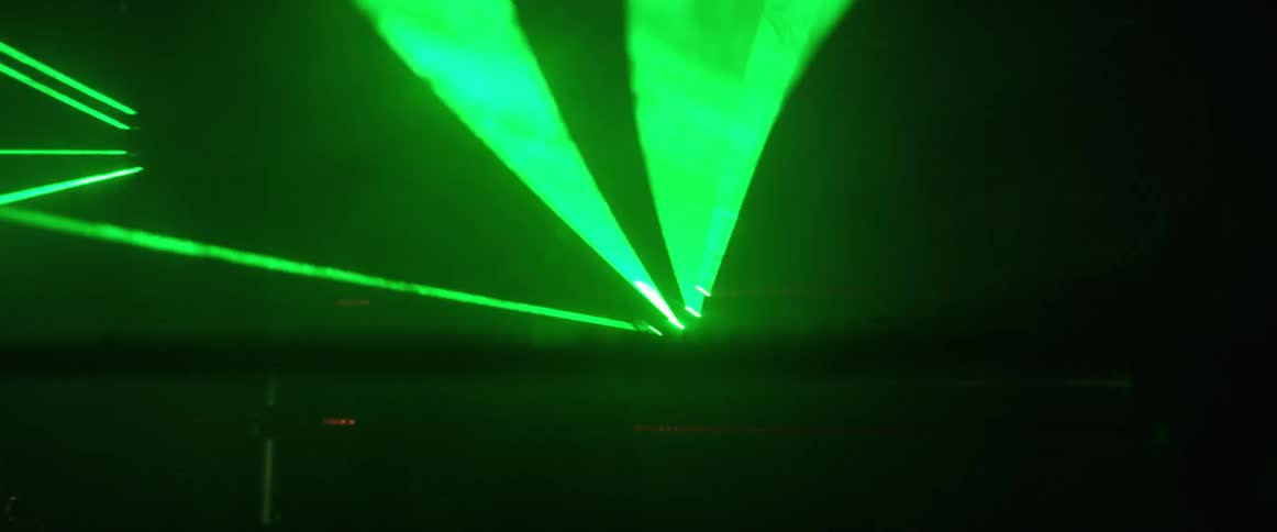 Green lights illuminate a wrestling ring