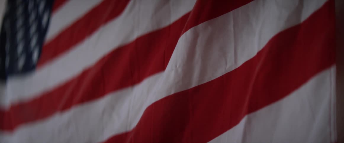 The stripes of a hanging american flag