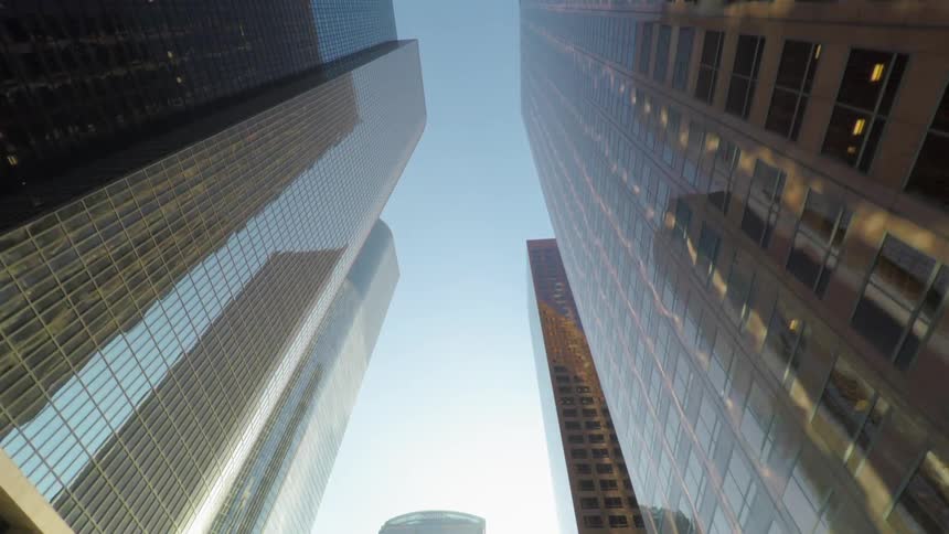 Tall buildings fill the clear sky