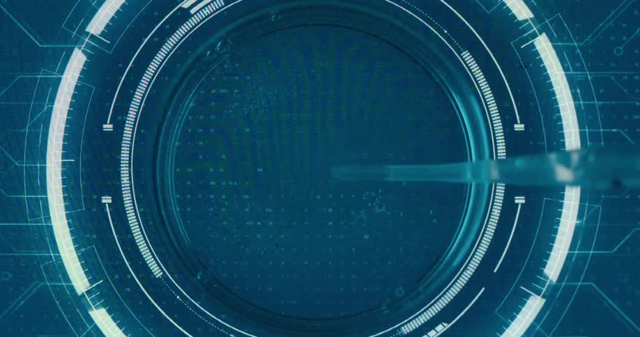 Close up of a liquid sample dropped with a pipette into a petri dish placed on a futuristic screen for analysis