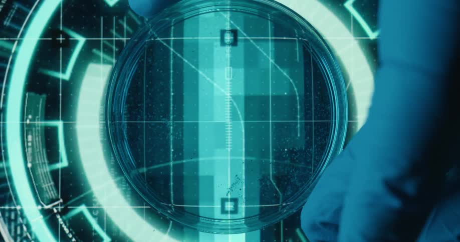 Gloved fingers adjust a petri dish on a screen with moving lines and shapes