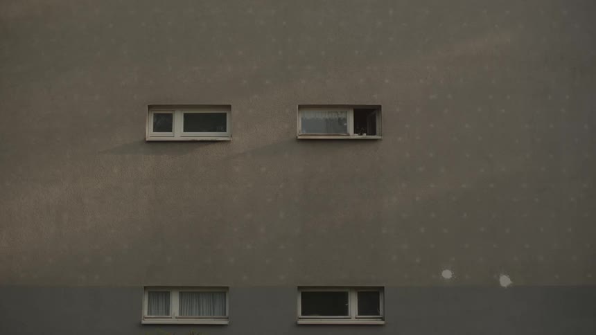 The side of a building with four windows