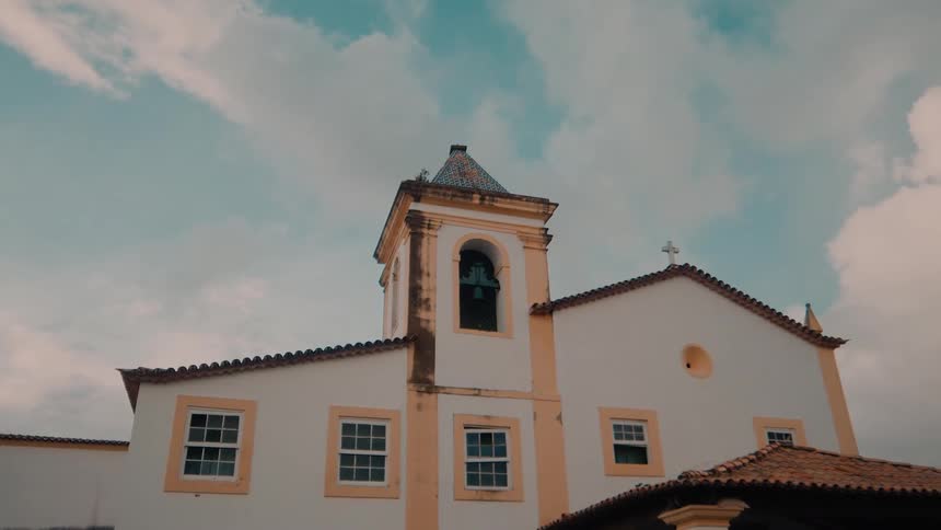 An old church and a blue sky with white clouds