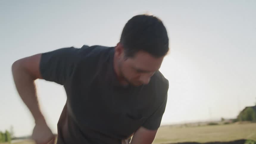 Man with a shovel working on fertile agricultural land