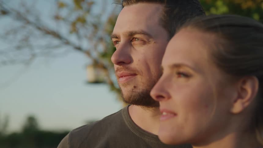 Man and woman observing in an outdoor environment