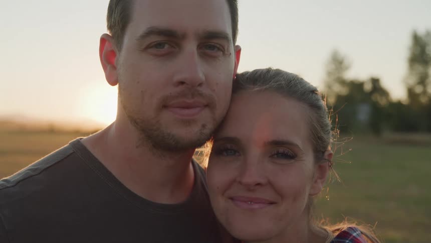 A man and woman are smiling together