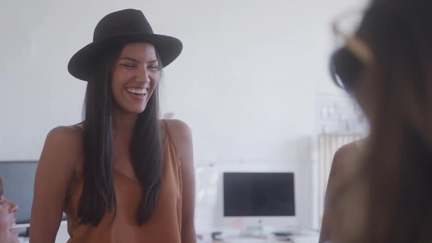 Smiling woman with a black hat