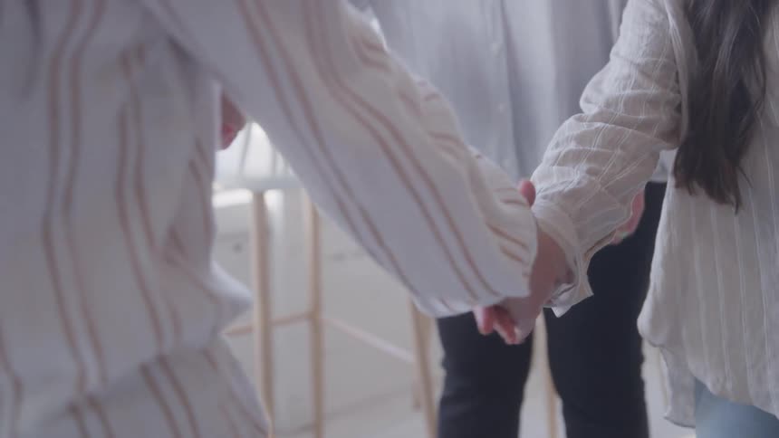 Women greeting each other with their hands