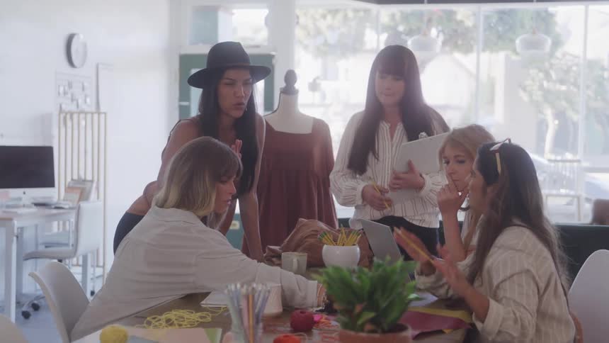 Group of women in a work environment talking