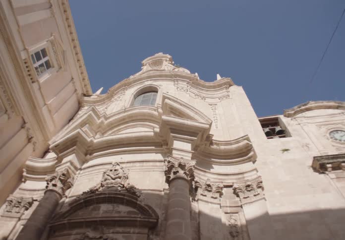 The stone building has arched windows