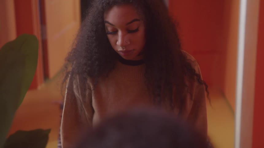 A woman looks up at the camera