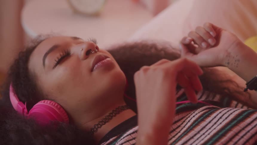 A girl listens to music