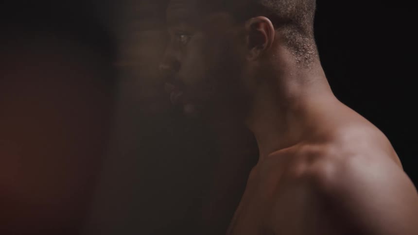 Side portrait of a man with focused facial expression without shirt