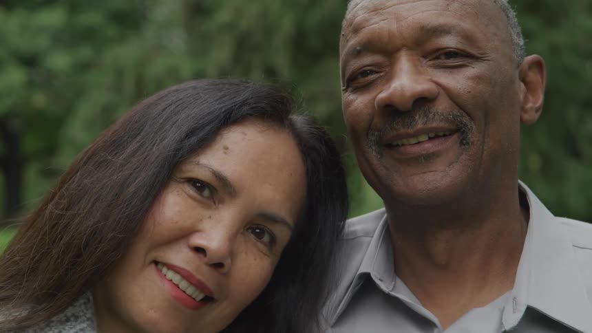 Portrait of a couple outdoors with happy expression