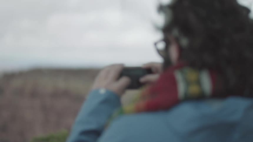 A person taking pictures of nature