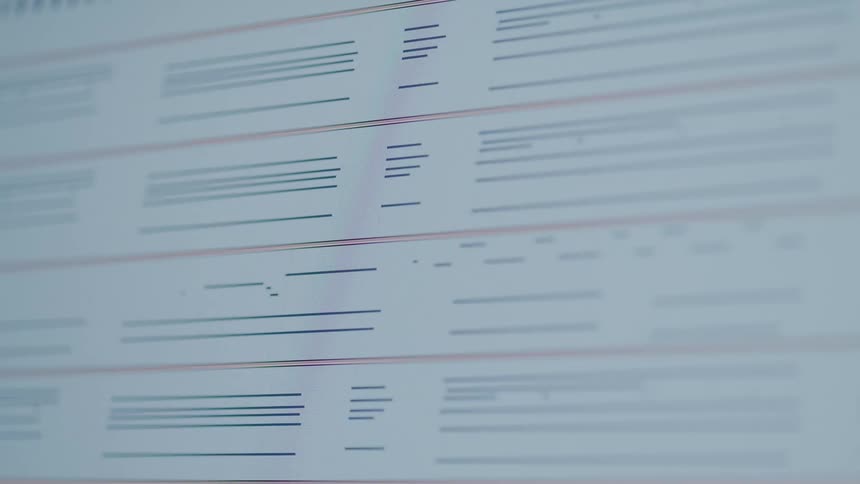 Lines scroll past on a large screen