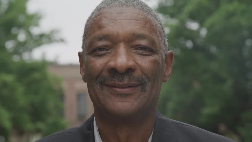 Portrait of a man outdoors with happy expression
