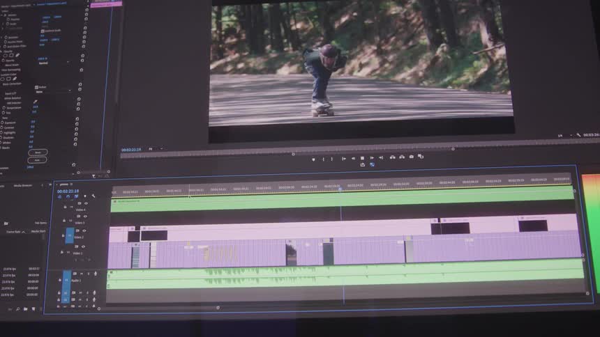 A video editing software interface displays a timeline with layered audio and video tracks and a preview of several clips