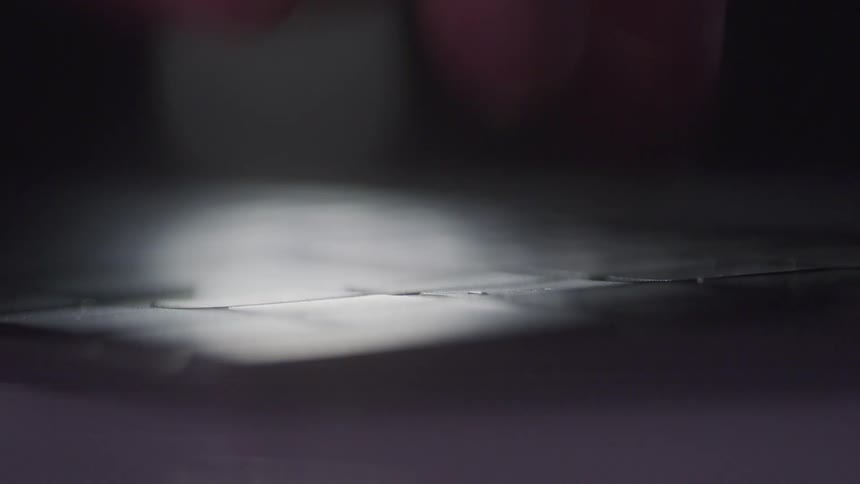 Fingers clicking keys on a device