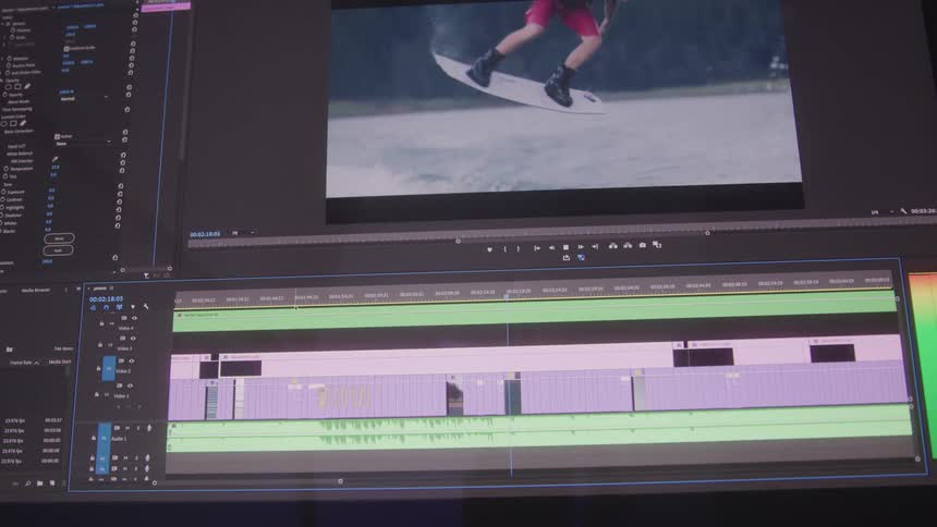 A video editing software is displayed on a computer screen showing footage of people engaging in fun activities
