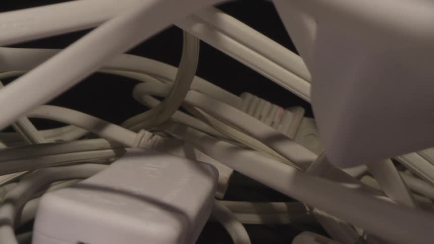 White wires and plugs are tangled