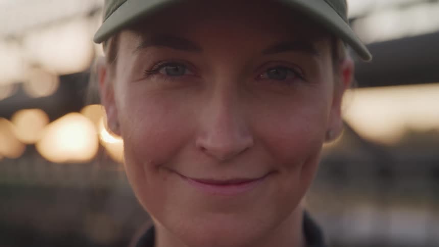 Portrait of a blonde woman in a hat with a happy expression