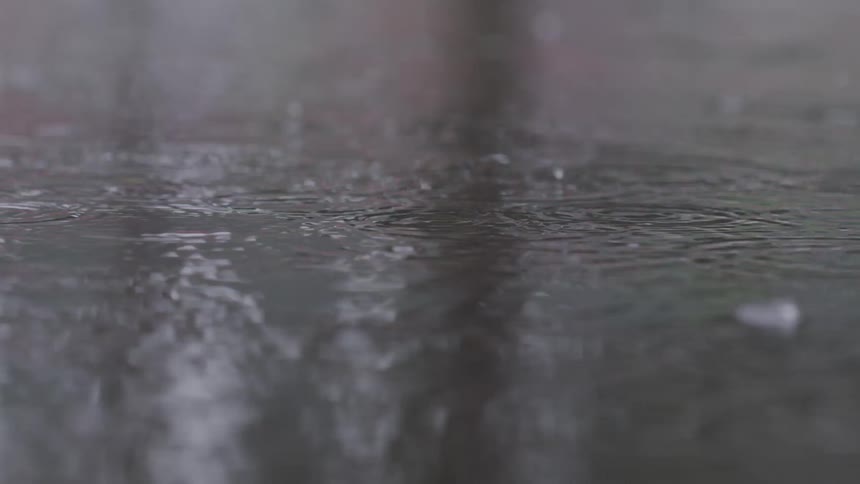 Rain is pouring and pooling in the puddle
