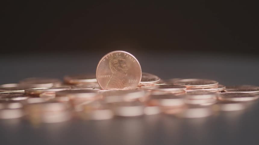 Coin standing surrounded by others