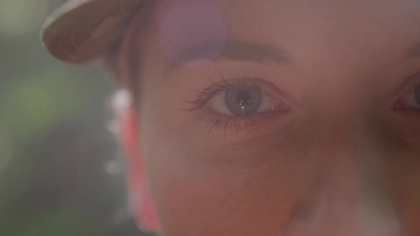 The woman blinks her eyes