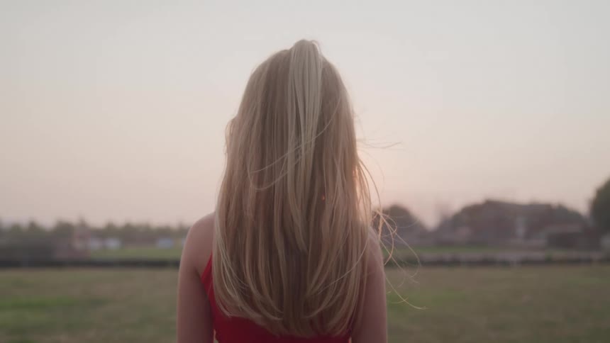 Blonde girl in a field
