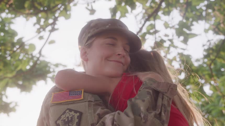 Military mom hugs daughter during emotional reunion