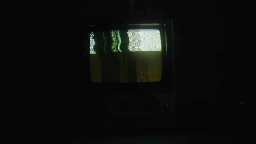 Retro television with no picture in a dark room