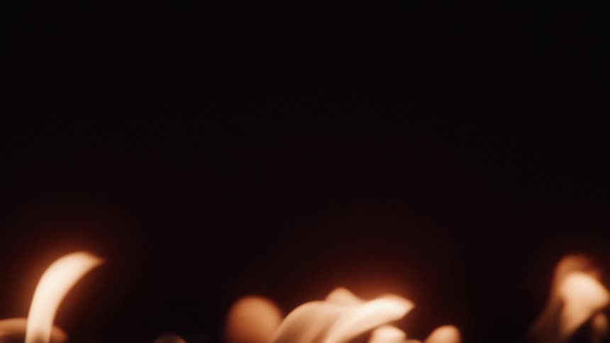 Flames of fire against a dark background