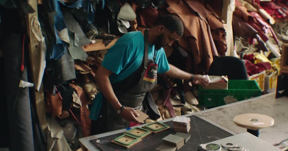 Craftsman working with fabrics in an indoor environment