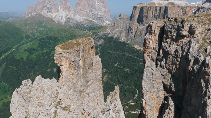 Flying up and over a mountain to see the valley below