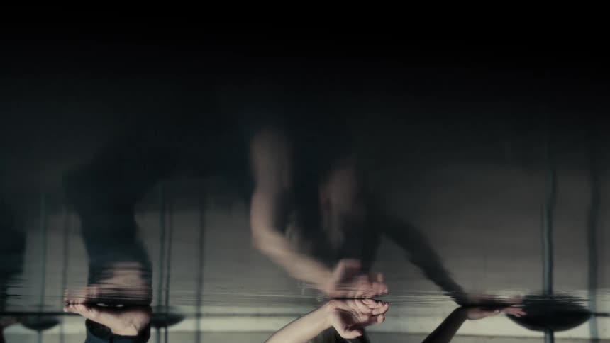 The woman is bending and doing yoga
