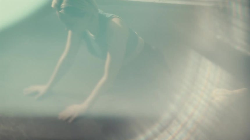 Woman indoors stretching her body