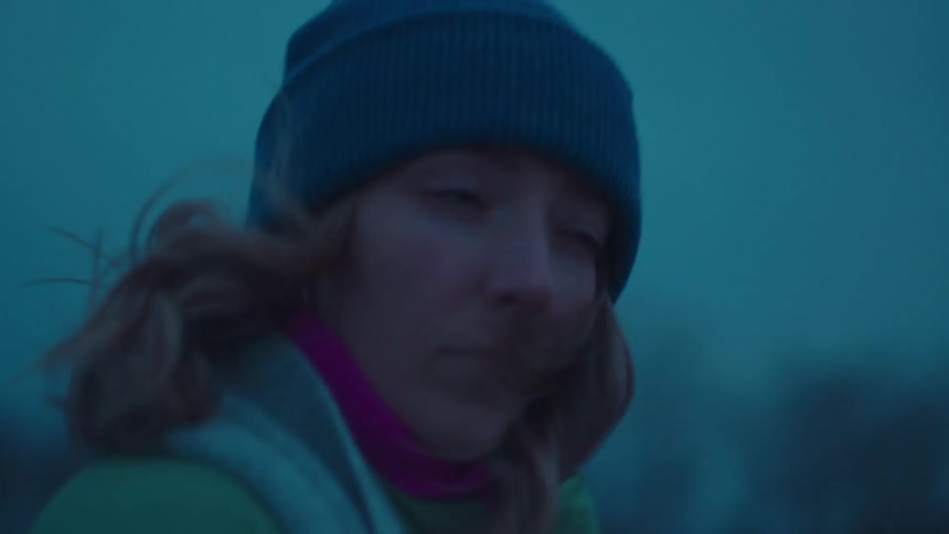 Woman in a hat on a beach one morning