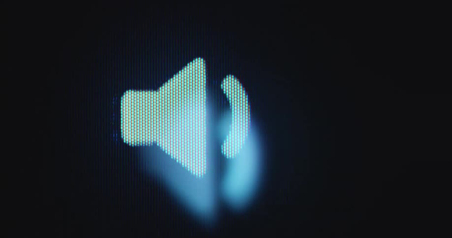 Close up of a speaker icon blinking on a pixelated device screen as the soundwaves are visualized by white moving bars in front of black background symbolizing the sound travelling through the digital space