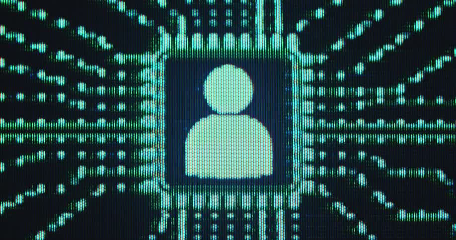 Extreme macro close up of pixelated digital monitor displaying human character or icon or emoji centrally placed on a computer chip while data flows through the green lines creating and filling the social media feed of active user