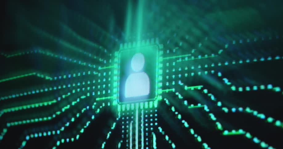 A glowing green pixelated motion graphic on the monitor shows a person or human icon with streams of light data and information flowing into it as the Artificial Intelligence creates a digital character or AI influencer