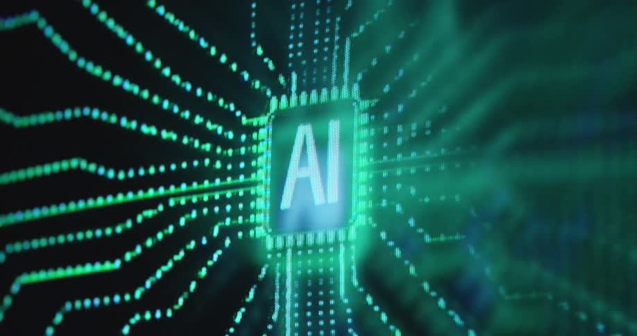 A conceptual animation depicts a symbol for artificial intelligence with the letters A and I on a chiplike shape and glowing lines representing data flow toward the processor displayed on digital screen as pixel art