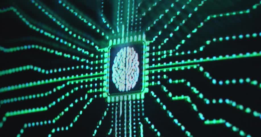 White human brain icon or symbol animation displayed on a pixelated computer or pc screen in the center of a printed circuit board or chip set receiving green glowing data flow via digital data lines gathering information