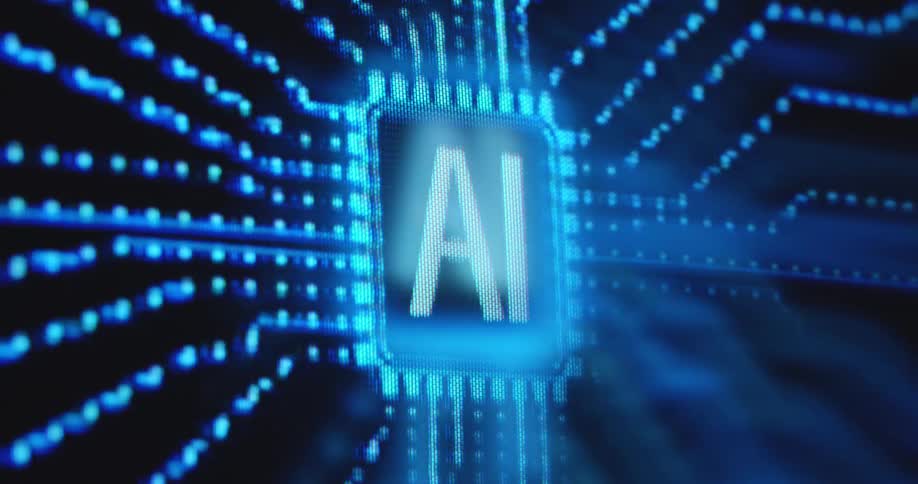 The pixelated RGB screen of a futuristic display device is presenting a smooth data flow animation showing dotted lines leading into a computer chip labelled AI as blue information is collected on the printed circuit board