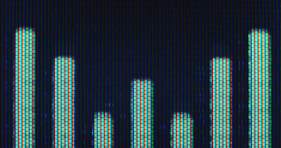 Abstract extreme macro close up of the RGB panel of a retro tube TV or computer screen with visible pixels displaying an EQ animation as the sound bars are pulsating to the music on a dark background symbolizing the levels of sound