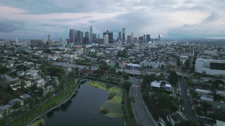 Aerial view of a Los Angeles kyline with roads and Echo Park Lake
