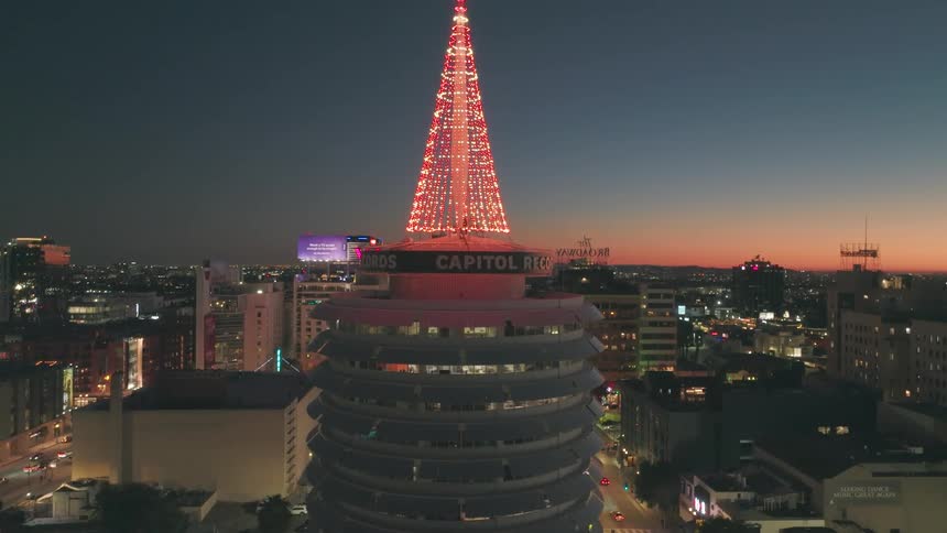 Aerial view of the Capitol Records Building with Christmas decorations at night
