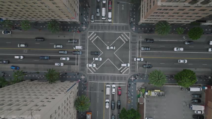 Aerial of cars at a traffic stop at Hollywood Blvd and Vine Street in Hollywood, California